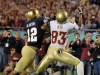 December 29 2011: Robert Blanton #12 plays defense whie Bert Reed #83 catches a touchdown during NCAA football Champs Sports Bowl between Notre Dame Fighting Irish and Florida State Seminoles at Florida Citrus Bowl Stadium, Orlando, Florida.