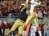 December 29 2011: Dan Fox #48 defends Rashad Greene #80 catching a touchdown during NCAA football Champs Sports Bowl between Notre Dame Fighting Irish and Florida State Seminoles at Florida Citrus Bowl Stadium, Orlando, Florida.