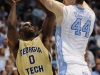 January 29th, 2012:North Carolina Tar Heels forward Tyler Zeller #44 defends Georgia Tech Yellow Jackets guard Mfon Udofia #0 during NCAA basketball game between the North Carolina Tar Heels and the Georgia Tech Yellow Jackets as part of Coaches Vs. Cancer, at The Dean E. Smith Center, Chapel HIll, NC.  UNC Players wore special pink Air Jordans.